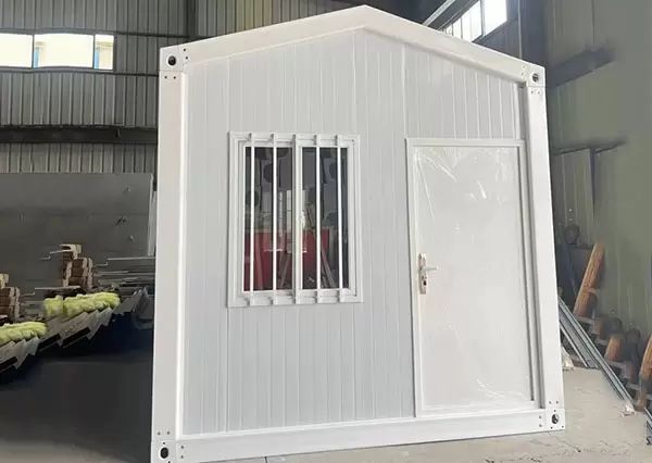 Quick assembly container house with herringbone roof